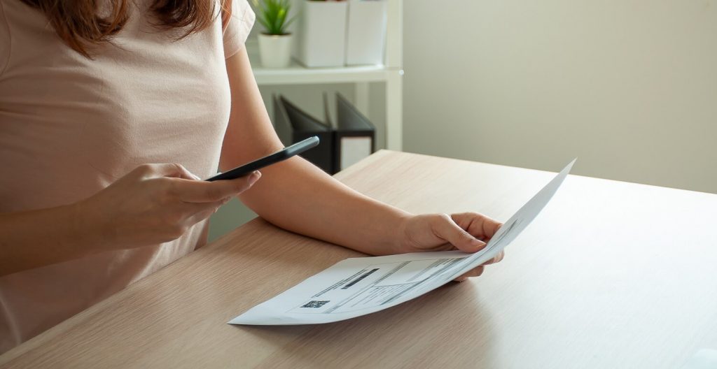 Woman photographing divorce papers